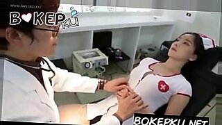 Busty Japanese wife cheats with student, hidden by books.