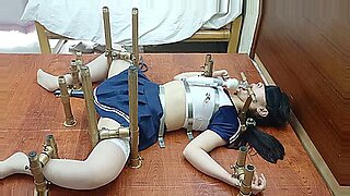 Chinese beauty bound and teased in intense BDSM scenario.