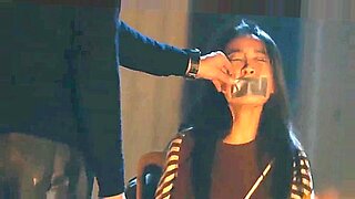 Tied-up Chinese beauty endures rough BDSM session.