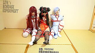 Red-headed Asian beauties in bondage and play.