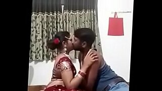 Sensual Indian couple explores romantic desires.