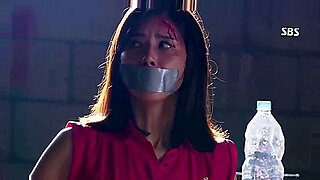 Korean beauty bound and gagged in BDSM play